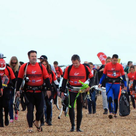 Kitesurfers walking on the beach 450x450 - Registration launches for VKSA 2015